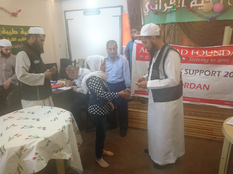 Here volunteers are distributing assistance to Palestinain orphans at the Ibnul Qayim centre in the Jerash refugee camp